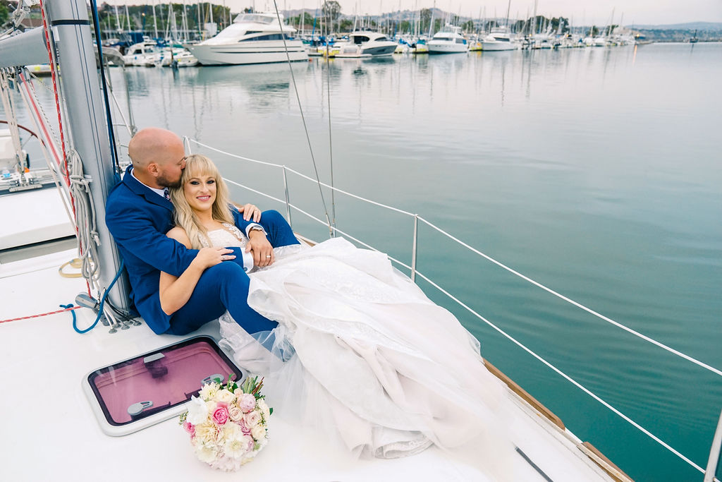 24 Bride _ groom on their sail boat ride in Dana Point