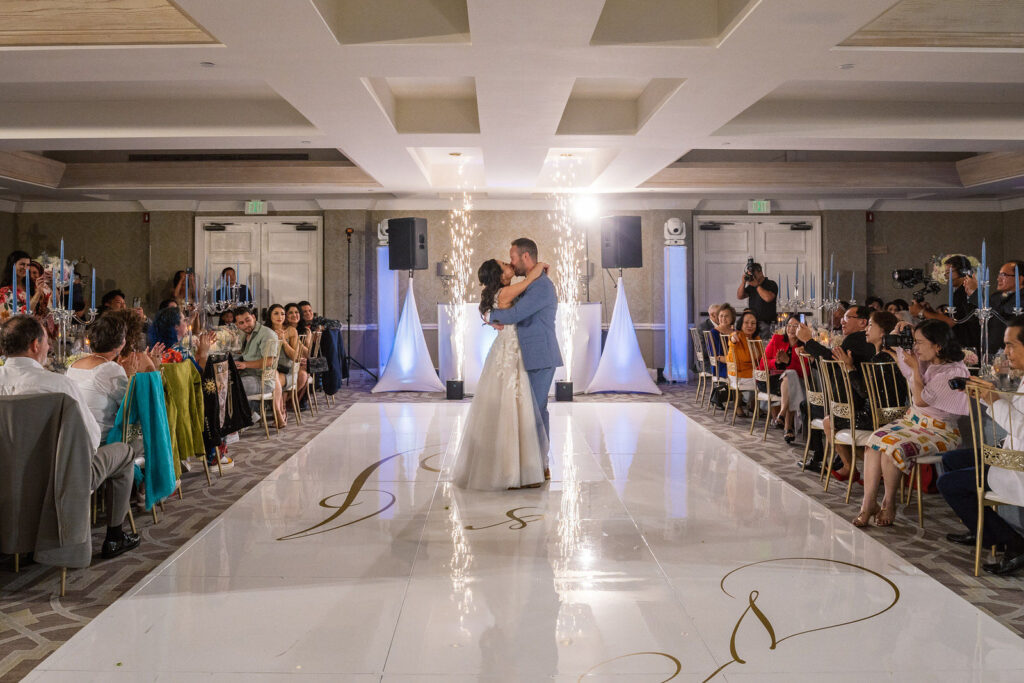 Bride & groom dancing their first dance on the dance floor at their reception.