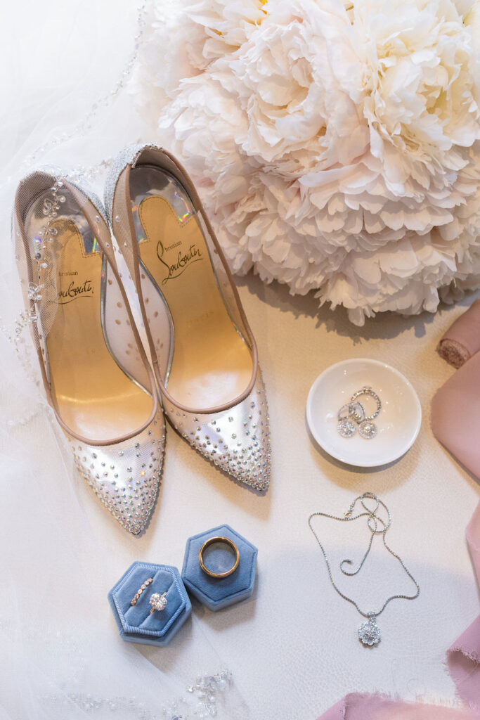 Detail shots of the bride's shoes, rings and jewelry