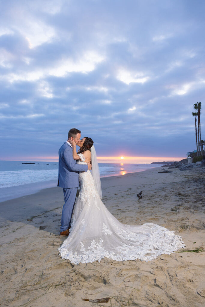 Bride & Groom romantic shot on the sand at Surf & Sand Resort in Laguna Beach.